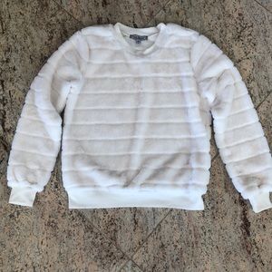 Soft and warm white fuzzy sweater. Like new